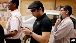 FILE - Ahmed Maher, an Egyptian activist released from prison, Jan. 5, 2017, waits to vote at a polling center in Cairo, Egypt, May 23, 2012.