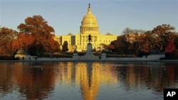 The US Capitol reflects the setting sun and is seen in the reflecting pool on Capitol Hill in Washington, Nov 2010 (file photo)