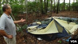 Richard points to what's left of the tent he called home for two years.