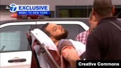 A still image captured from a video from WABC television shows a conscious man believed to be New York bombing suspect Ahmad Khan Rahami being loaded into an ambulance after a shoot-out with police in Linden, New Jersey, Sept. 19, 2016.