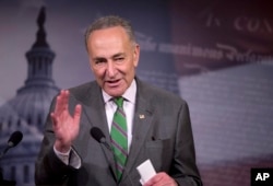FILE - Senator Charles Schumer speaks to reporters on Capitol Hill about the Supreme Court decision on campaign financing, April 2, 2014.
