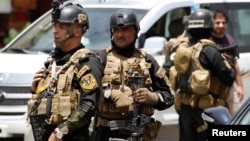 Membres des Unites des forces Speciales irakiennes pendant une importante operation de securite a Baghdad dans le district de Amiriya 18 Juin 2014. 