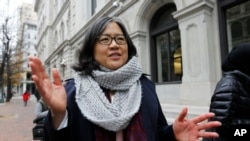 Cecillia Wang, deputy legal director of the American Civil Liberties Union, answers questions outside the 4th U.S. Circuit Court of Appeals building in Richmond, Va., Dec. 8, 2017. The court listened to arguments Friday on the latest version of President Donald Trump's travel ban.