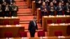 FILE - Chinese President Xi Jinping arrives for the closing session of the Chinese People's Political Consultative Conference (CPPCC) at the Great Hall of the People in Beijing, March 13, 2019.