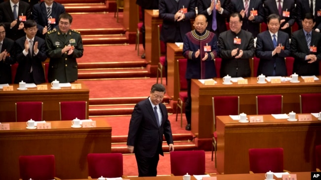 中国国家主席习近平2019年3月13日抵达北京人大会堂参加中国人大会议。