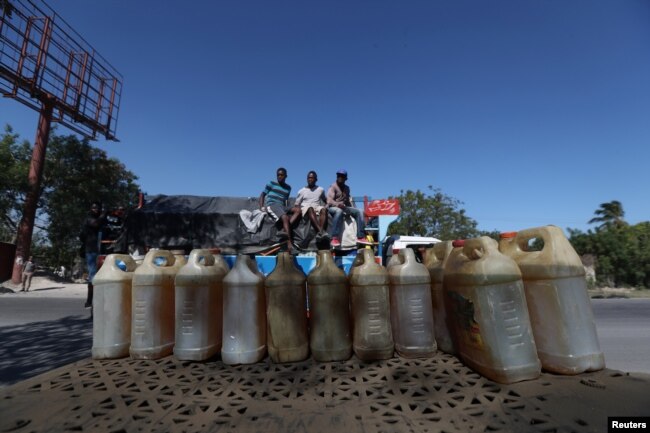 Containers filled with fuel that is sold on the black market are offered in a street in Port-au-Prince, Haiti, February 24, 2019.