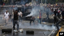 Demonstrators shout slogans against Venezuela's President Nicolas Maduro during a protest in Caracas, April 8, 2017.