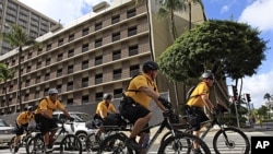 Police officers patrol near the site of the upcoming Asia-Pacific Economic Cooperation (APEC) summit in Honolulu, Hawaii, November 8, 2011.