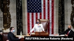 U.S. Speaker of the House Nancy Pelosi (D-CA) wields her gavel ahead of the final passage in the House of Representatives of U.S. President Joe Biden's $1.9 trillion coronavirus disease.