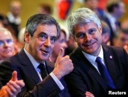 Francois Fillon, left, former French prime minister, and Laurent Wauquiez, head of the Les Republicains party, attend a political rally in Chassieu, near Lyon, France, April 12, 2017.