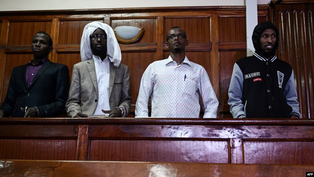 (L-R) Terror suspects Osman Abdi Dagane, Sahal Diriye, Hassan Aden Hassan and Mohamed Ali Abdikar, stand in the dock in Nairobi, Jan. 29, 2019, charged with carrying out a terrorist attack at Garissa University College four years ago. 
