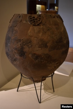 A Neolithic jar, possibly a Neolithic qvevri used for brewing wine from the site of Khramis Didi Gora south of Tbilisi on display at the Georgian National Museum is seen in this handout photo received November 13, 2017. Judyta Olszewski/Handout via REUT