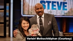Nala, the internet's most famous cat, and her owner, Varisiri Methachittiphan, at Steve Harvey Show.