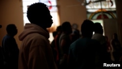 Cuban migrants, waiting for their appointment to request asylum in the U.S., attend a meeting at a church being used as a shelter in Ciudad Juarez, Mexico, April 6, 2019.