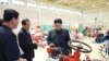 North Korean leader Kim Jong Un visits a farm machine exhibition in this undated photo released by North Korea's Korean Central News Agency (KCNA) in Pyongyang, Aug. 6, 2015. 