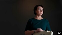 Heather Ryan, a former supervisory special agent with the Naval Criminal Investigative Service, poses for a photo in Wentzville, Mo, Jan. 24, 2018.