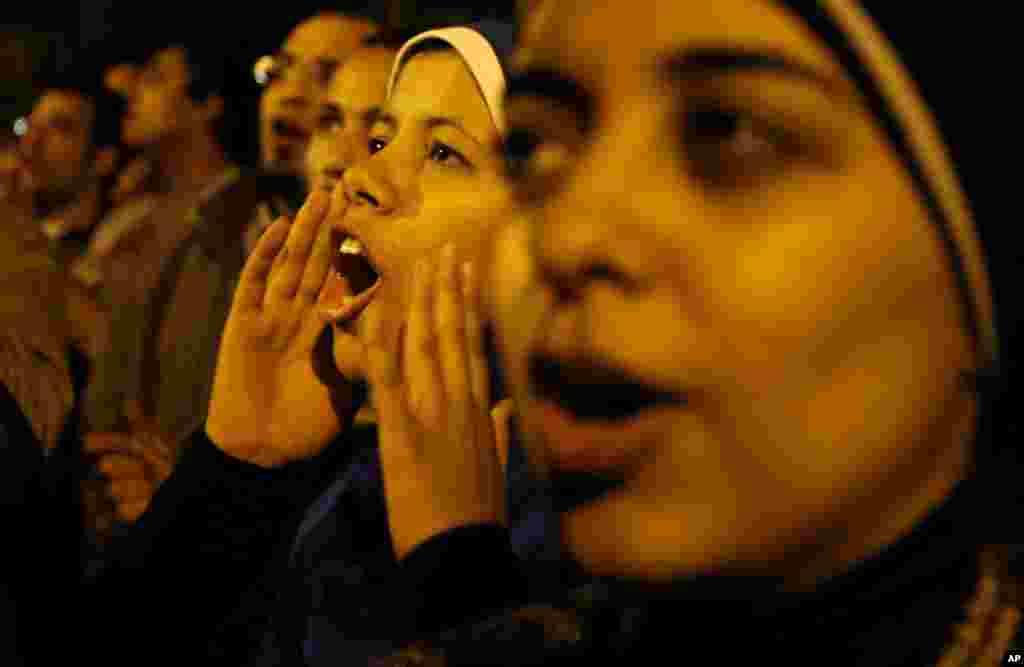 Protesters chant slogans during a demonstration in front of the presidential palace in Cairo, Egypt, Sunday, Dec. 9.