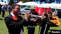 A Mariachi band plays at The Quail, a motorsports gathering, in Carmel, California, August 16, 2013.