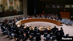 The United Nations Security Council votes on resolution on humanitarian aid for Syria at U.N. headquarters in New York, Feb. 22, 2014. 