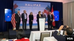 A U.S. Senate delegation consisting of Jeanne Shaheen, D-N.H., James Risch, R-Idaho, Tim Kaine, D-Va., Chris Coons, D-Del., Roger Wicker, R-Miss., and Joni Ernst, R-Iowa, speaks at the Halifax International Security Forum. (Jay Heisler/VOA)