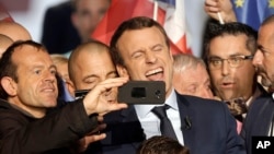 Independent centrist presidential candidate Emmanuel Macron reacts as a photo is taken after his speech during a campaign meeting in Marseille, France, April, 1, 2017. The two-round presidential election is set for April 23 and May 7.