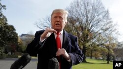 FILE - President Donald Trump talks with reporters before traveling to the G-20 Summit in Buenos Aires, on the South Lawn of the White House, Nov. 29, 2018, in Washington. 