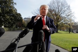 President Donald Trump talks with reporters before traveling to the G-20 Summit in Buenos Aires, on the South Lawn of the White House, Nov. 29, 2018, in Washington.