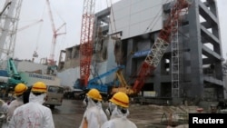 A general view of the cover installation for the spent fuel removed from the cooling pool is pictured at the No.4 reactor building at Tokyo Electric Power Company's tsunami-crippled Fukushima Daiichi nuclear power plant in Fukushima prefecture, June 12, 2013.