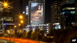 A photo, taken with a long exposure, shows a billboard promoting the film, Wonder Woman, in Tel Aviv, Israel, June 6, 2017.
