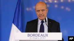 Former French prime minister Alain Juppe delivers his speech in Bordeaux, southwestern France, Monday, March 6, 2017. Juppe has confirmed that he won't be a replacement for the embattled conservative presidential candidate Francois Fillon if he decides to