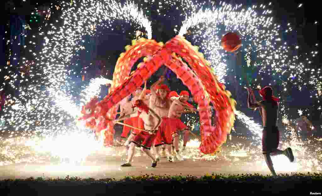 People perform a fire dragon dance during the Chinese Lunar New Year holidays in Wuhan, Hubei province, China, Jan. 30, 2017.