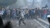 Police clash with protesters after clashes in Jakarta, Indonesia, early May 22, 2019.