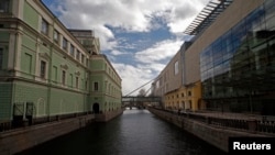 A view of the new Mariinsky Theatre (R) facing the original theater across a canal in St. Petersburg, April 30, 2013.