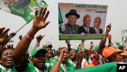 Supporters of Nigeria President Goodluck Jonathan, sing slogans, during an election campaign rally, at Tafawa Balewa Square in Lagos, Nigeria, Thursday, Jan. 8, 2015.