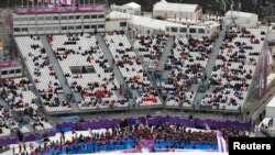 The spectator stands are seen half-filled at the Rosa Khutor Extreme Park during the 2014 Sochi Winter Olympics, Feb. 9, 2014. 