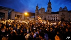 Demonstrators light candles during a vigil for activists who have been killed since the signing of the peace accord in Bogota, Colombia, July 6, 2018. Thousands of people gathered at the Bolivar's square for the vigil.