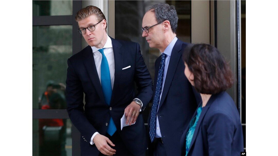 Alex van der Zwaan, left, leaves Federal District Court in Washington, April 3, 2018. A federal judge sentenced Alex van der Zwaan to 30 days in prison.