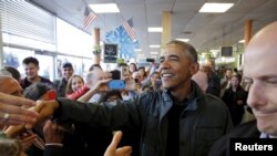 President Barack Obama greets patrons in Snow City Cafe in Anchorage, Alaska, Sept. 1, 2015.