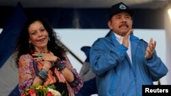 FILE - Nicaraguan President Daniel Ortega and Vice President Rosario Murillo greet supporters in Managua, Nicaragua, Oct. 13, 2018.