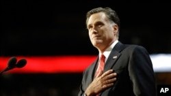 Mitt Romney acknowledges delegates before speaking at the Republican National Convention in Tampa, Florida, August 30, 2012.