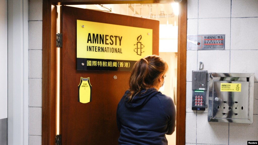 A woman enters the Amnesty International Hong Kong office, after its announcement to close citing China-imposed national security law, in Hong Kong, China Oct. 25, 2021. 