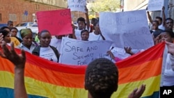 FILE - Women protest against a sentence of 14 years in prison, with hard labor, given to two men in Malawi under Malawi's anti-gay legislation.