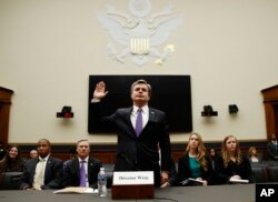 FILE - FBI Director Christopher Wray is sworn in during a House Judiciary hearing on Capitol Hill in Washington, Thursday, Dec. 7, 2017.
