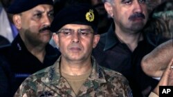 FILE - In this July 26, 2016 photo, Lt. Gen. Naveed Mukhtar attends funeral prayers in Karachi, Pakistan. 