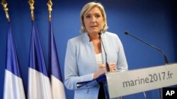 FILE - France 2016 US Election: French far-right leader Marine Le Pen makes a statement on the presidential election in the United States of America, Nov. 9, 2016 in Nanterre, outside Paris.