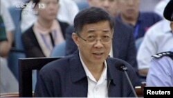 In this image taken from video, former Chinese politician Bo Xilai addresses a court at Jinan Intermediate People's Court in eastern China's Shandong province, Aug. 24, 2013.