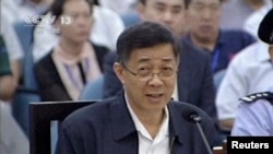In this image taken from video, former Chinese politician Bo Xilai addresses a court at Jinan Intermediate People's Court in eastern China's Shandong province, Aug. 24, 2013.