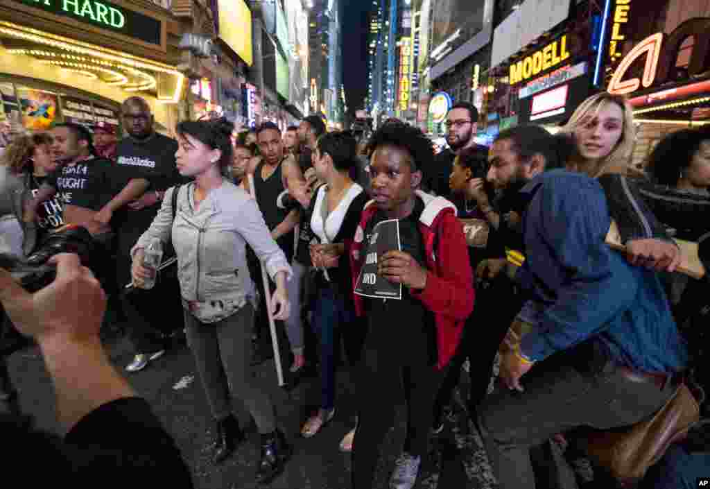 People gathered in several areas of New York to protest the death of Freddie Gray. In this photo, protesters are herded off 42nd Street by police near Times Square, April 29, 2015, in New York.