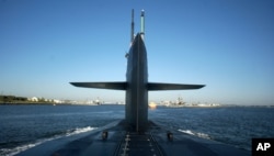 FILE - The Ohio-class USS Florida pulls into port in Mayport, Fla., after completing exercises off the coast of Florida, May 18, 2006.