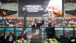 President Barack Obama arrives to speak to crowds attending the memorial service for former South African president Nelson Mandela. 